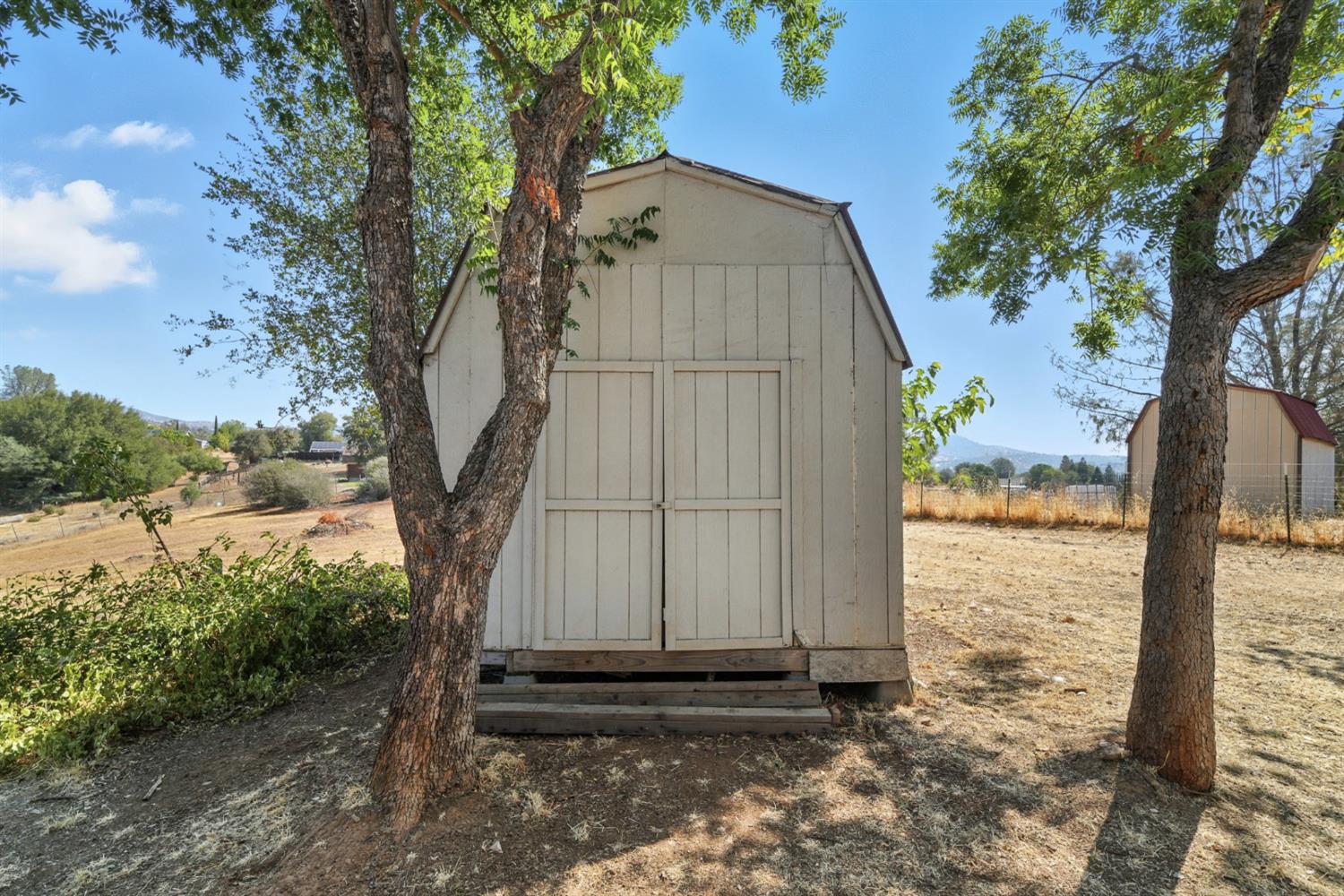 2422 Cheyenne Road Copperopolis, CA 95228 - Photo 50 of 64 a view of a small yard next to a yard