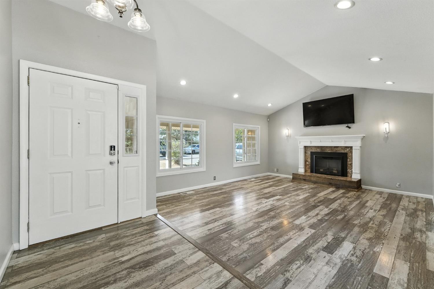 2422 Cheyenne Road Copperopolis, CA 95228 - Photo 6 of 64 a view of empty room with wooden floor and fireplace