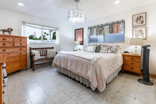 a bedroom with a bed and furniture