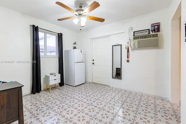 a view of a hallway with closet and wooden floor