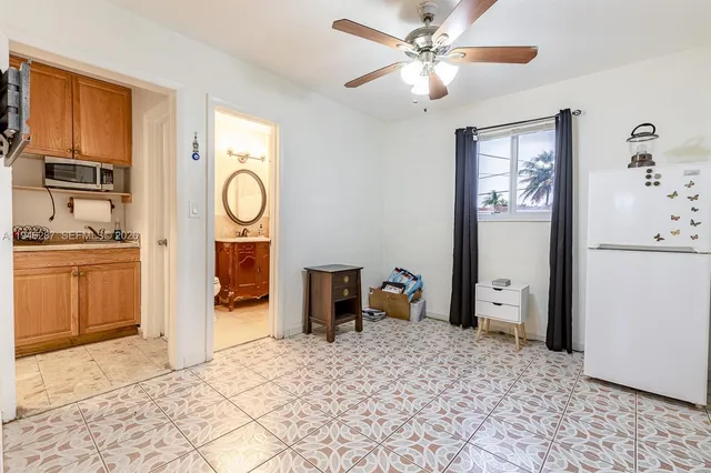 a bedroom with a bed and cabinets