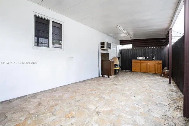 a view of work space with furniture and closet