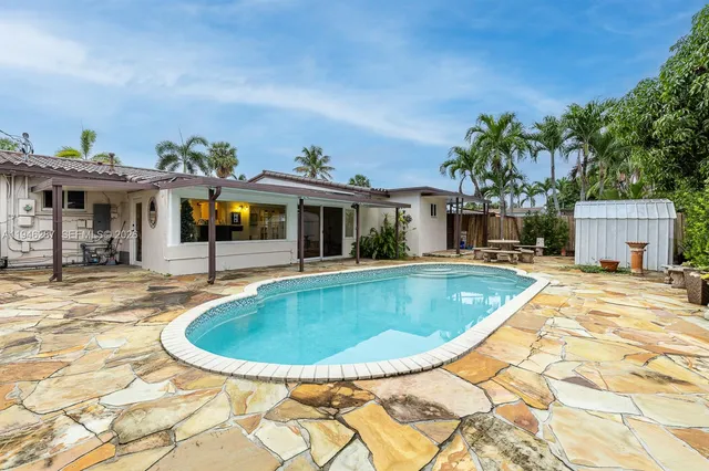 a view of a house with swimming pool