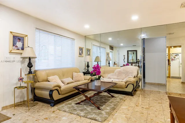 a living room with furniture and a couch