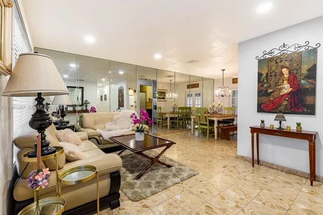 a living room with lots of furniture and air hockey table