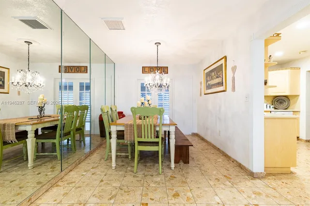 a dining room with a table and chairs