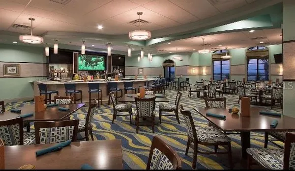 a kitchen with a table and chairs