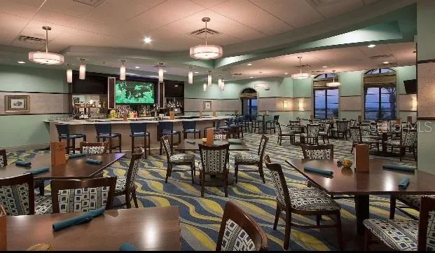 a kitchen with a table and chairs