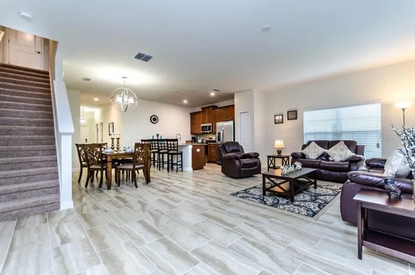 a living room with furniture and a table