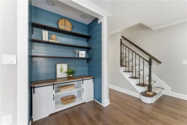 a view of an entryway with wooden floor