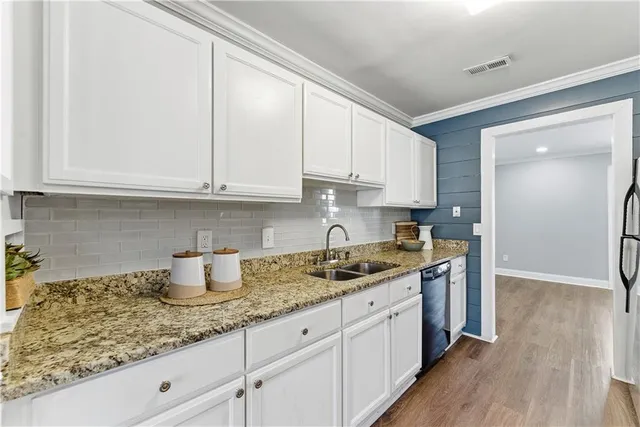 a kitchen with a sink and cabinets