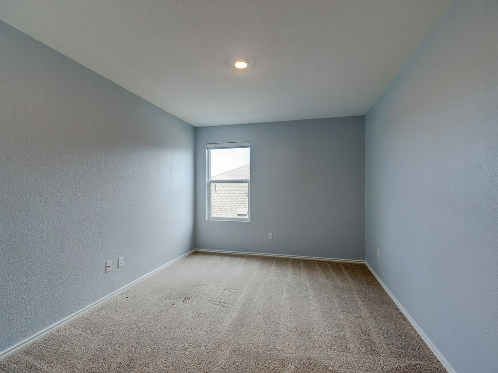 1716 Frontenac Street Leander, TX 78641 - Photo 27 of 34 an empty room with a window