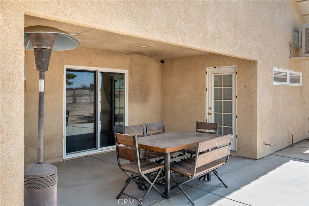 14952 Rivers Edge Road Helendale, CA 92342 - Photo 29 of 33 a view of a dining room with furniture and wooden floor