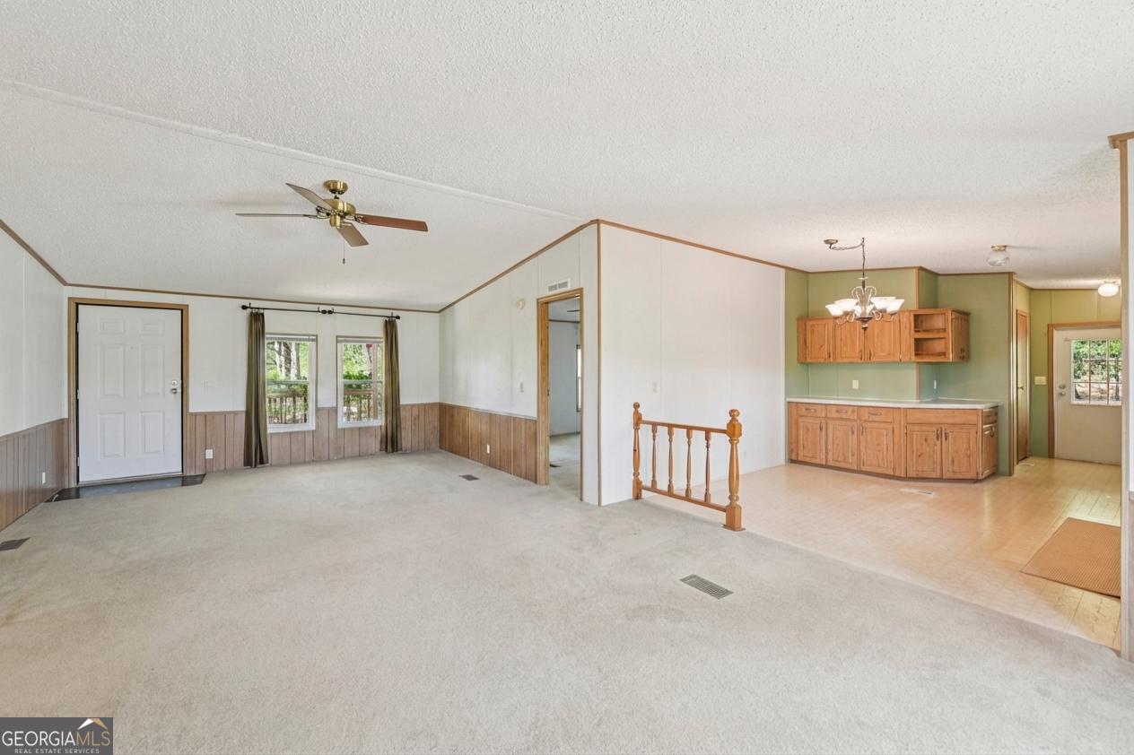 362 Horton Road Dahlonega, GA 30533 - Photo 14 of 57 a view of a livingroom with furniture and a ceiling fan