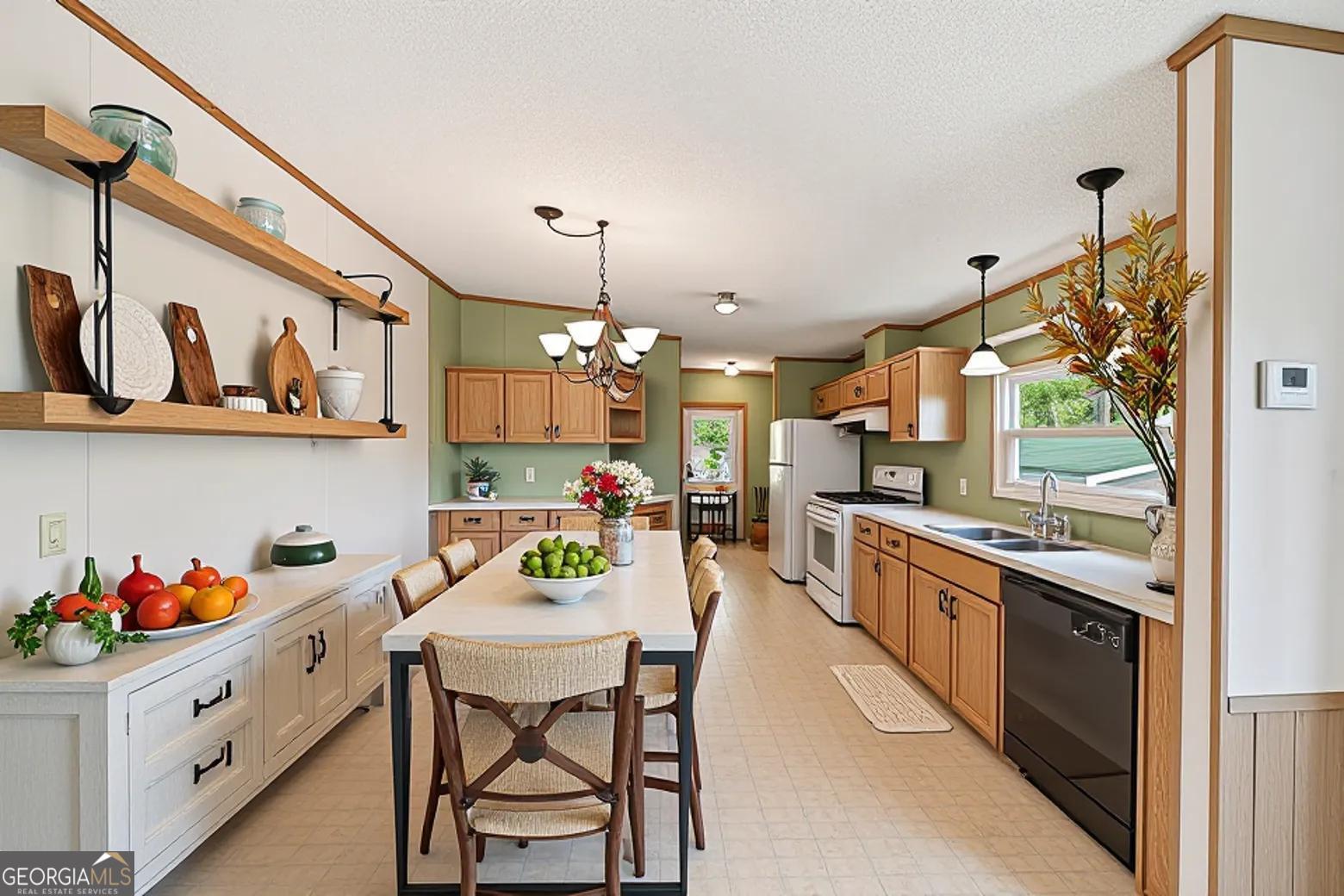 362 Horton Road Dahlonega, GA 30533 - Photo 16 of 57 a kitchen with stainless steel appliances granite countertop a sink and cabinets