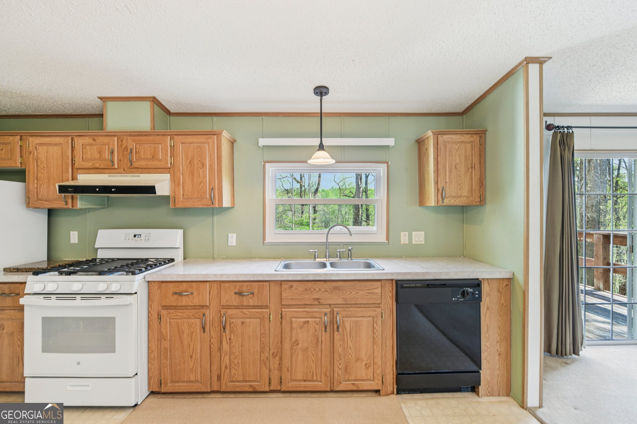 362 Horton Road Dahlonega, GA 30533 - Photo 17 of 57 a kitchen with a sink stove and cabinets