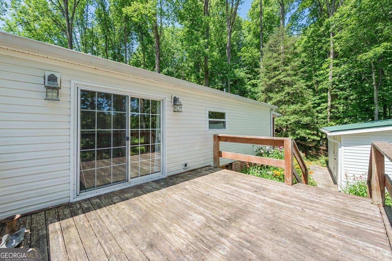 362 Horton Road Dahlonega, GA 30533 - Photo 38 of 57 a view of backyard with large trees and wooden fence