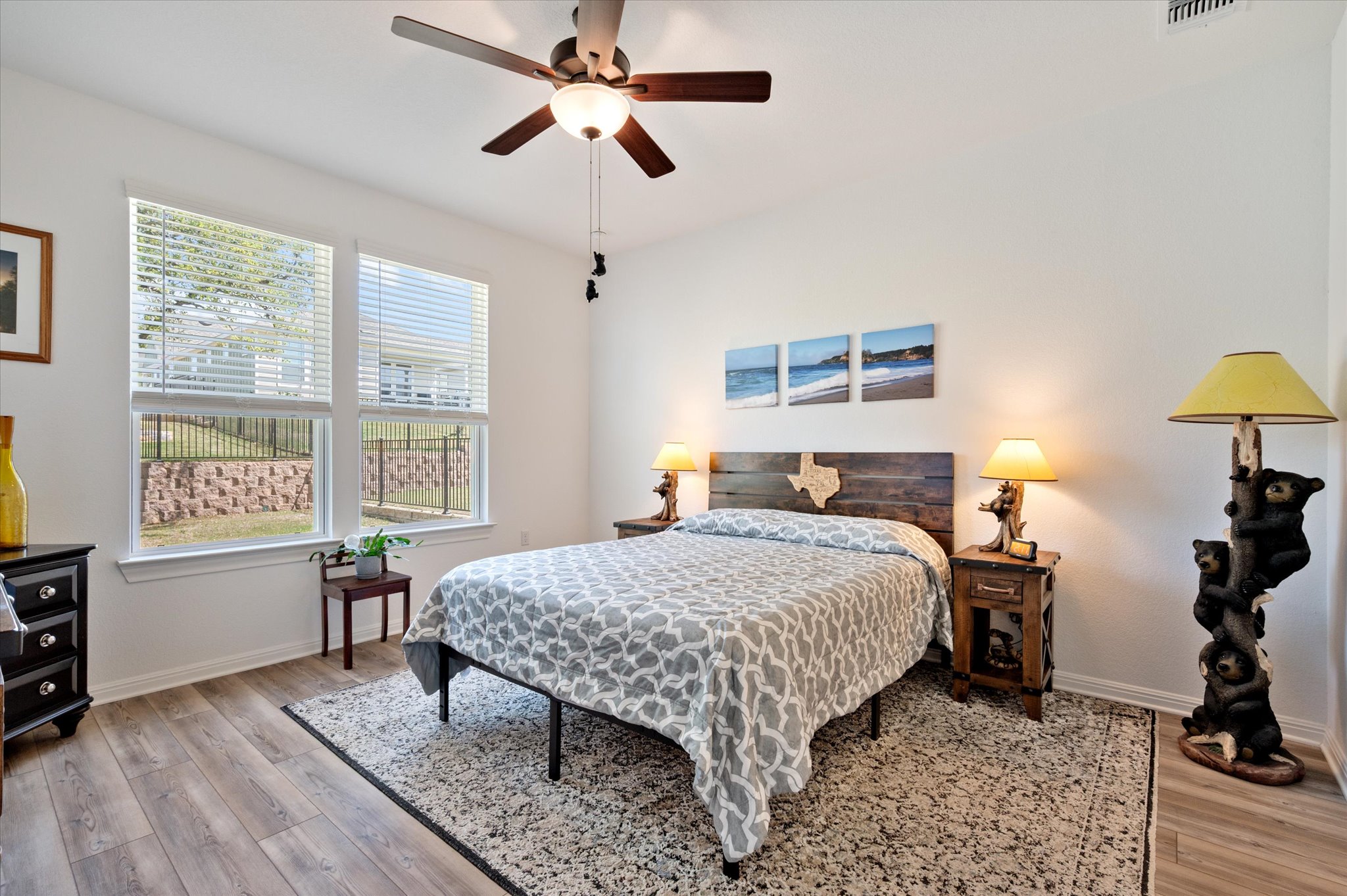 112 Clay Hl Street Georgetown, TX 78633 - Photo 18 of 29 a bedroom with a bed a table and a window