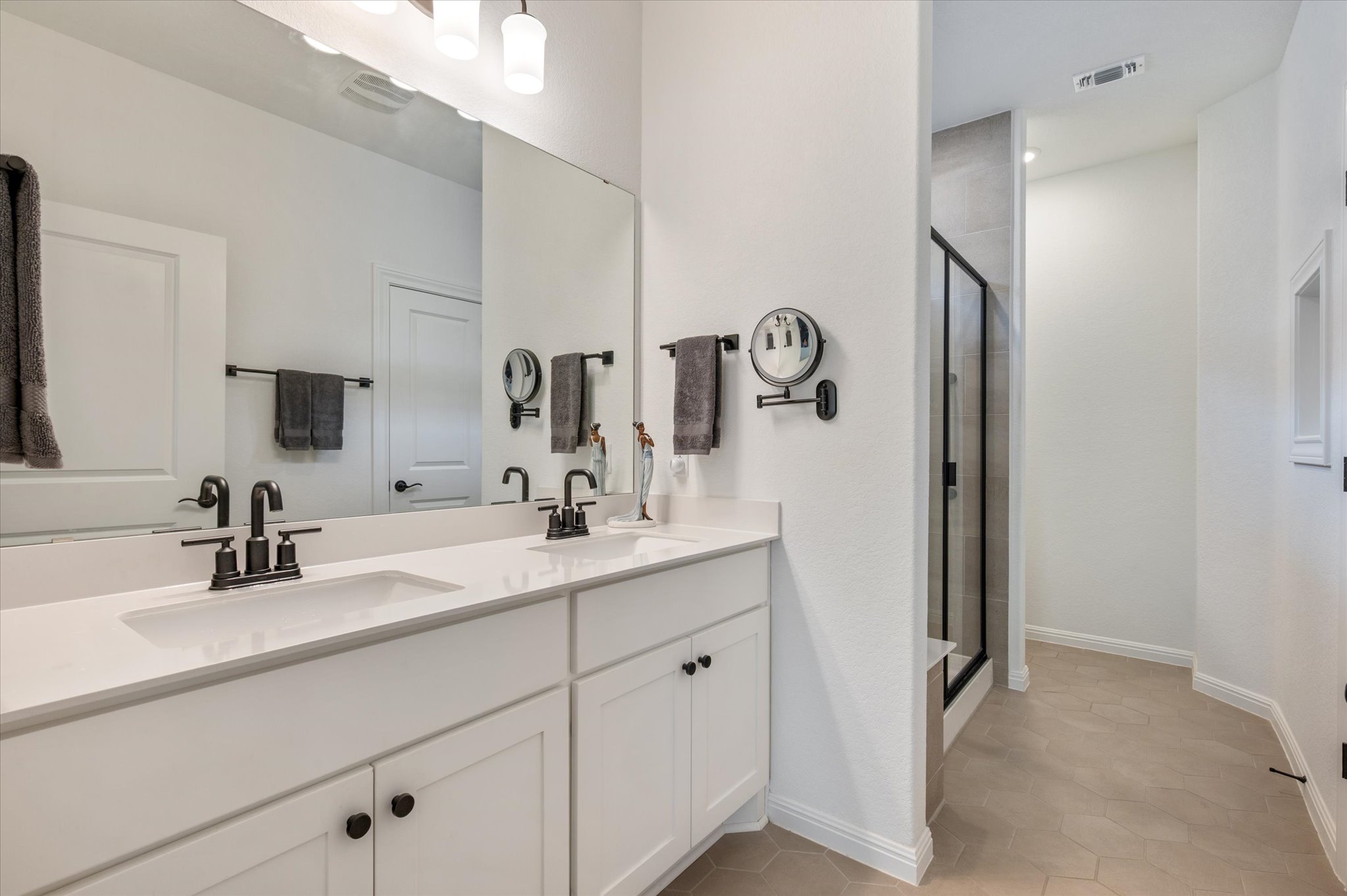 112 Clay Hl Street Georgetown, TX 78633 - Photo 21 of 29 a bathroom with a double vanity sink and mirror