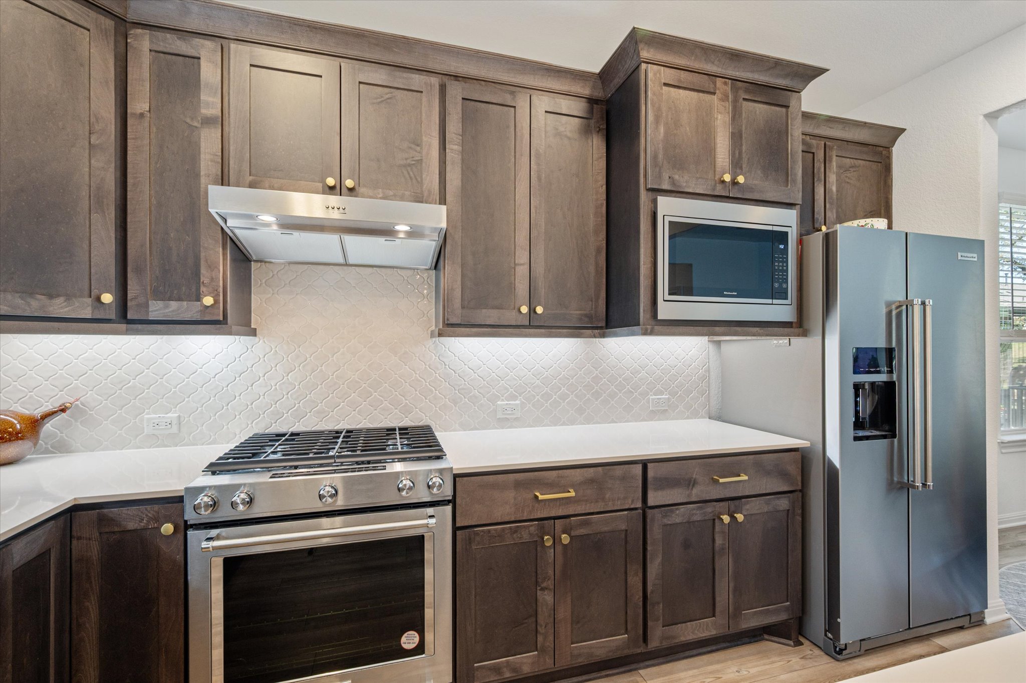 112 Clay Hl Street Georgetown, TX 78633 - Photo 6 of 29 a kitchen with stainless steel appliances a sink stove and refrigerator