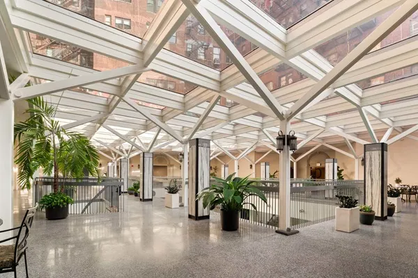 a view of a porch with a table and chairs