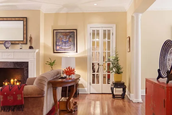 a living room with furniture and a fireplace