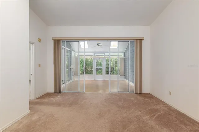 a view of an empty room with a fireplace