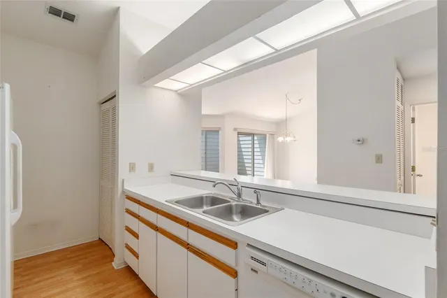 a bathroom with a sink and a window