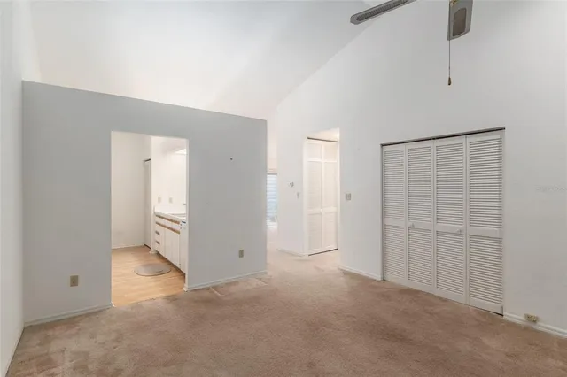 an empty room with closet area
