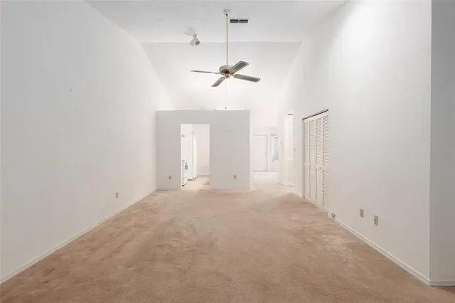en view of a chandelier fan in a room
