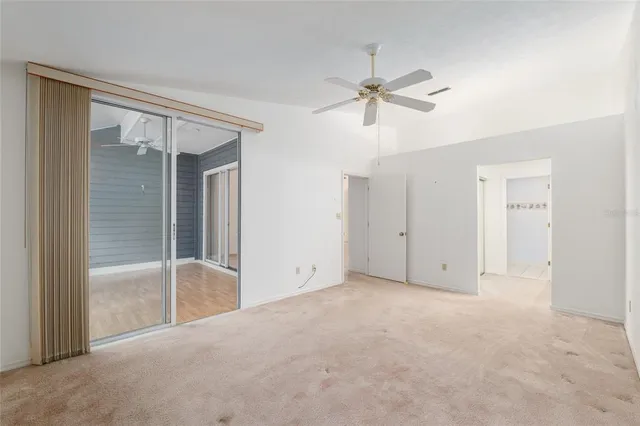 a view of an empty room with a glass door