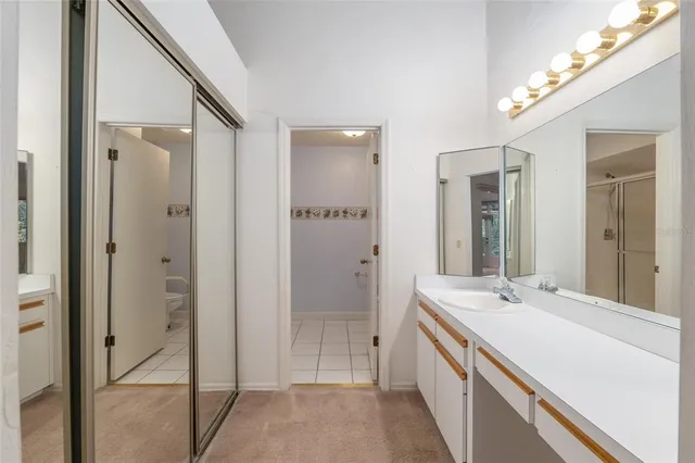 a bathroom with a double vanity sink and mirror