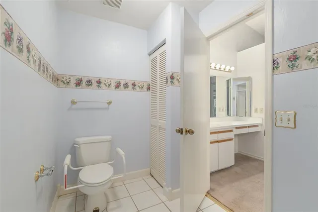 a bathroom with a toilet sink and shower