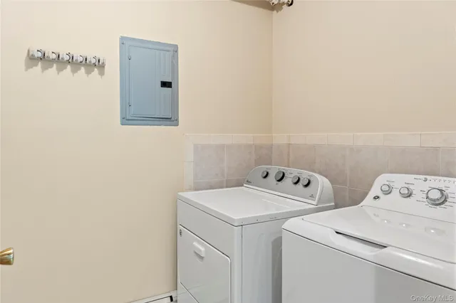 a utility room with dryer and washer