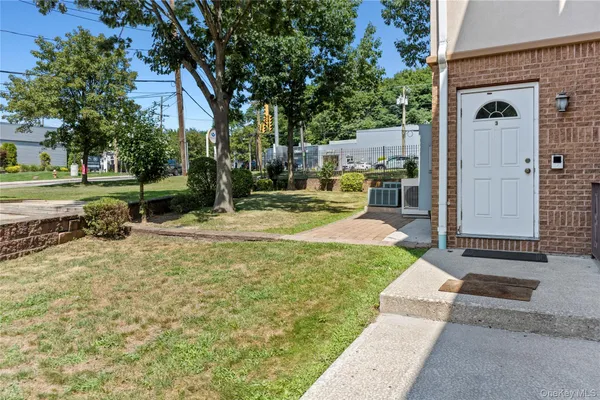 a view of a car park in front of house