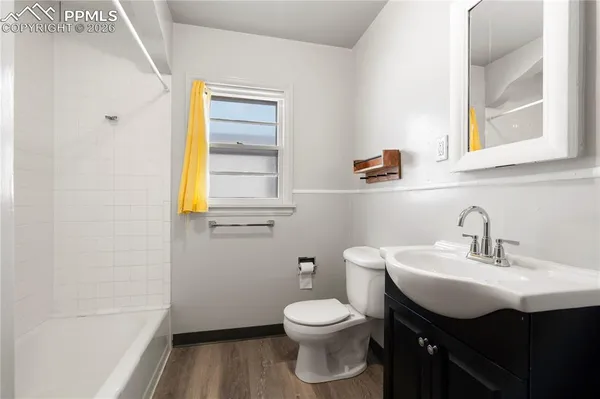 a bathroom with a sink toilet and vanity