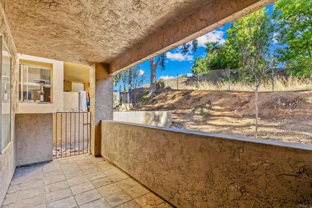 a view of balcony with furniture