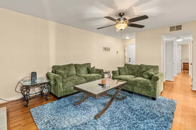 a living room with furniture and a rug