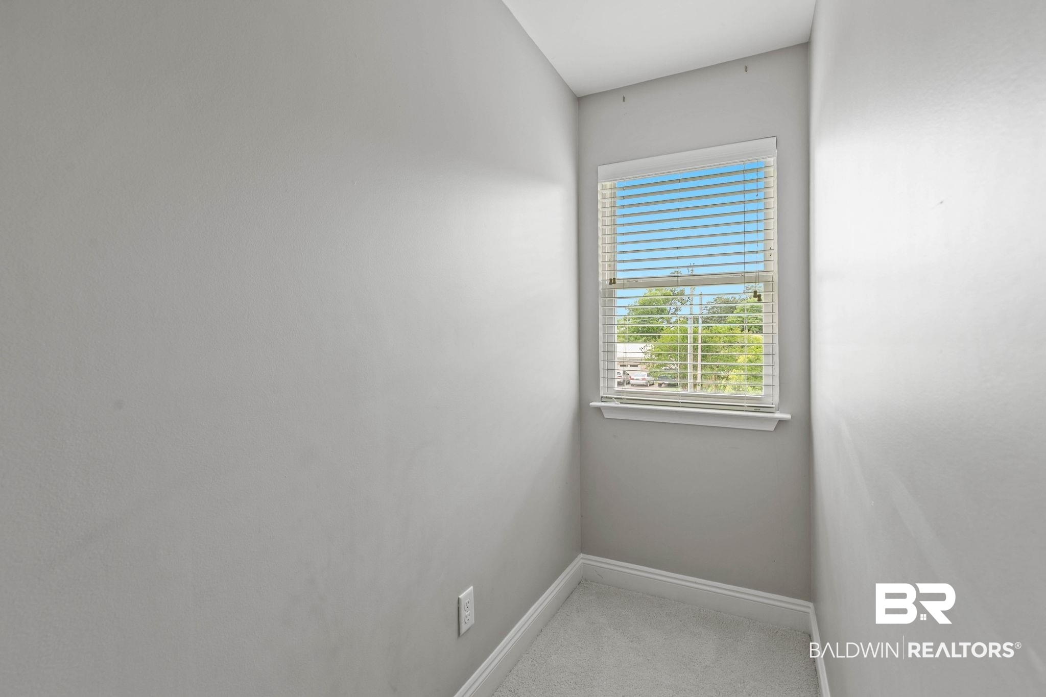22810 High Ridge Road Fairhope, AL 36532 - Photo 45 of 78 Recessed window with white blinds, light gray wall paint, white trim, and light gray carpeted flooring
