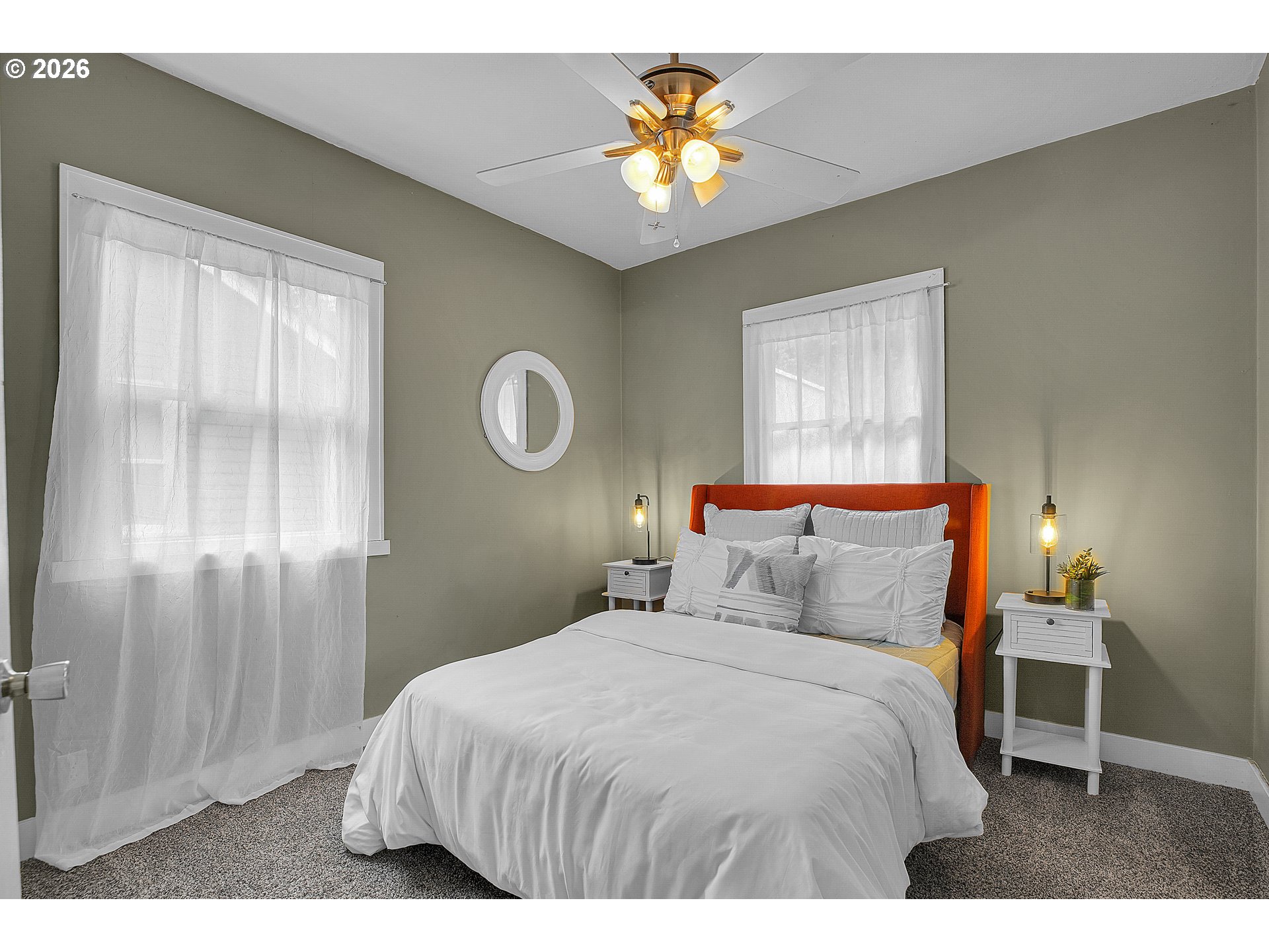 140 21st Street Northeast Salem, OR 97301 - Photo 27 of 44 a bedroom with a bed and a chandelier