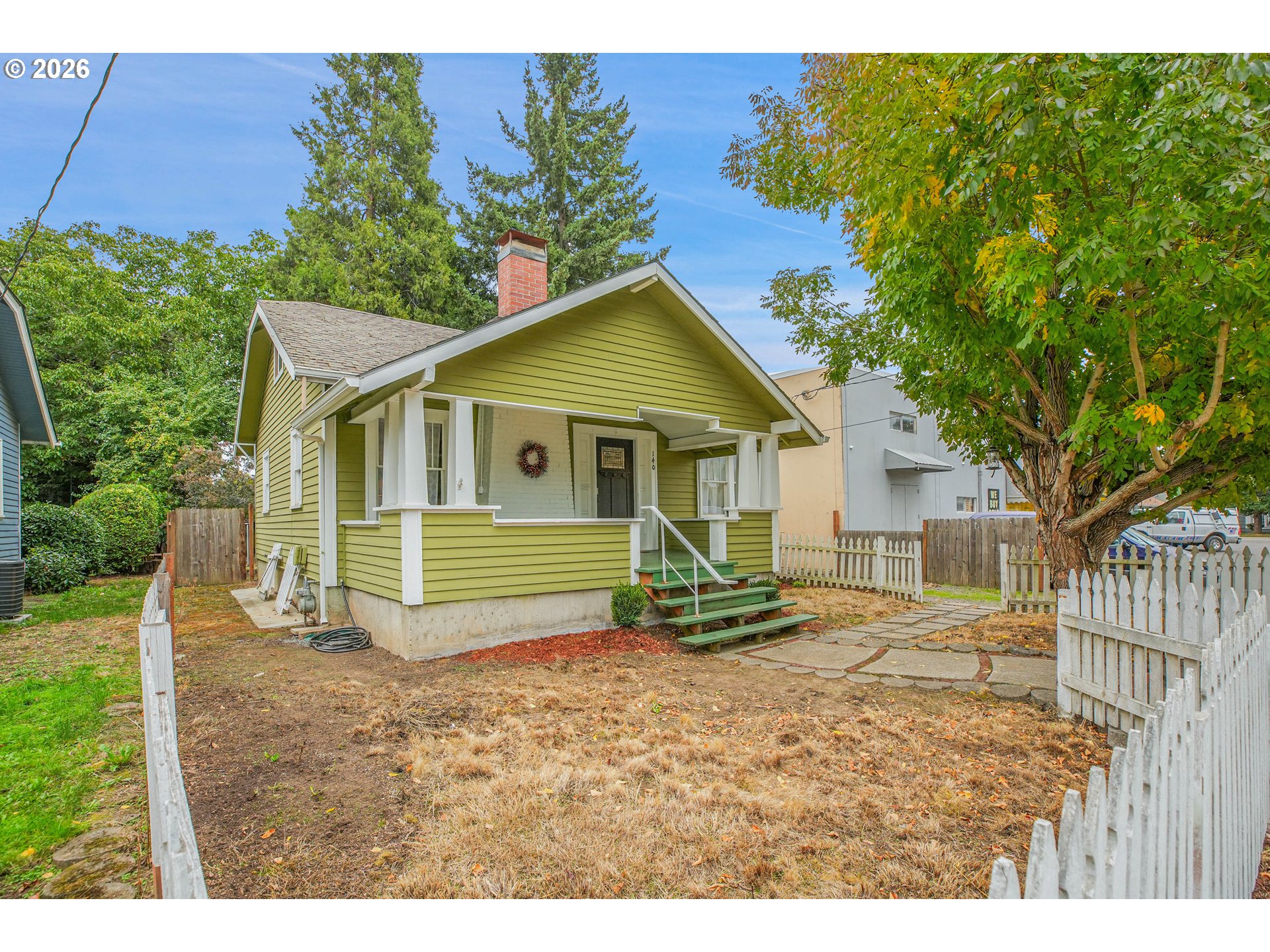 140 21st Street Northeast Salem, OR 97301 - Photo 3 of 44 a front view of a house with a yard