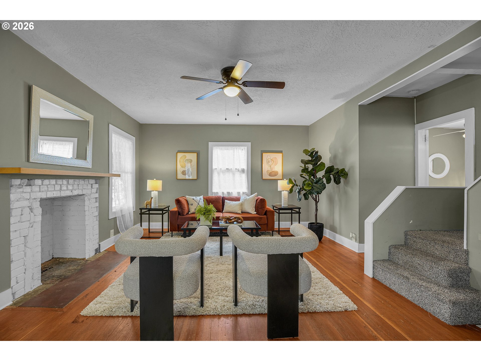 140 21st Street Northeast Salem, OR 97301 - Photo 8 of 44 a living room with fireplace furniture and a potted plant