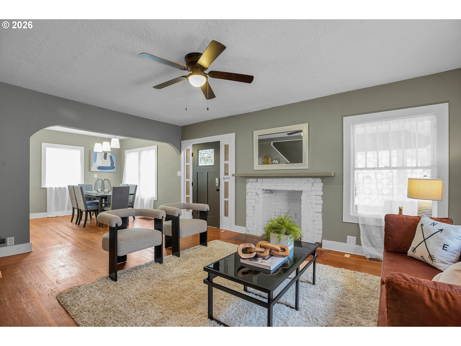 140 21st Street Northeast Salem, OR 97301 - Photo 9 of 44 a living room with furniture a fireplace and a large window