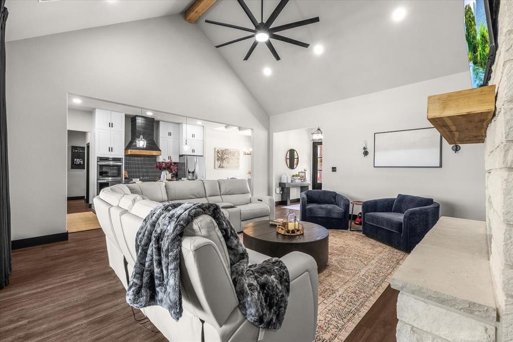 6080 Cates Rnch Drive Godley, TX 76044 - Photo 11 of 40 Vaulted ceiling with exposed wood beam, recessed lighting, and a modern ceiling fan