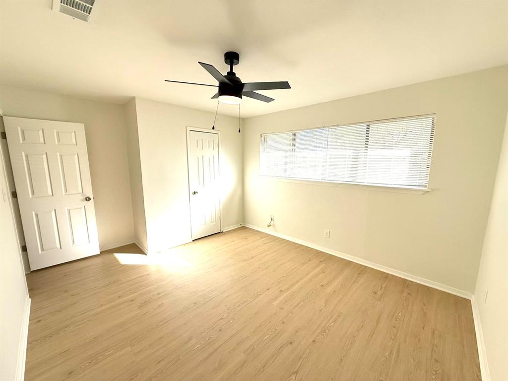 1401 Arvel Circle Azle, TX 76020 - Photo 15 of 26 wooden floor in an empty room with a window