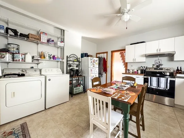 a view of kitchen with cabinets and outdoor space
