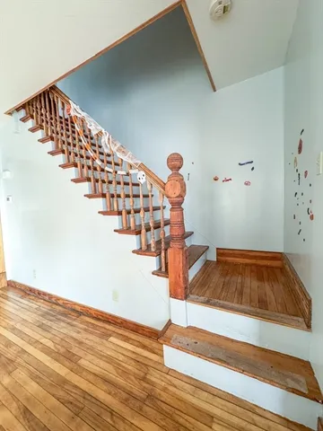 a view of entryway with wooden floor