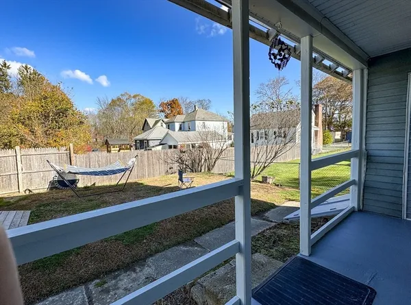 a view of a balcony with wooden floor
