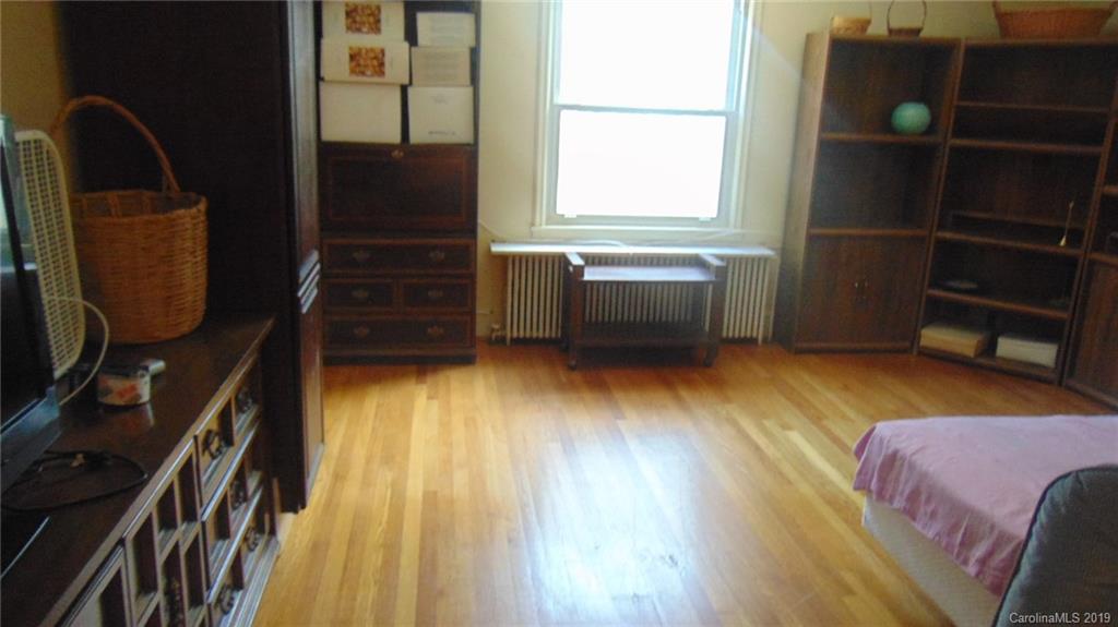 3516 Brevard Road Hendersonville, NC 28791 - Photo 12 of 20 a view of walk in closet with clothes and shoes