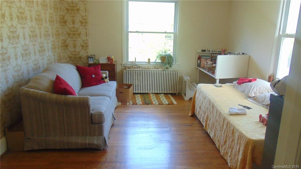 3516 Brevard Road Hendersonville, NC 28791 - Photo 14 of 20 a living room with furniture and a window
